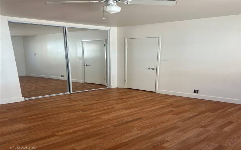 Large bedroom with mirrored wardrobe