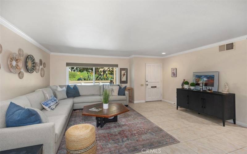 LIVING ROOM WITH CROWN MOLDING...