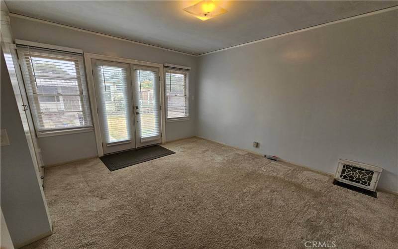 bedroom #1 with a cedar closet & french doors