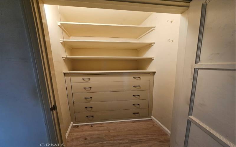 Hallway closet with built ins