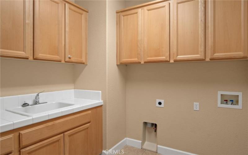 Laundry room is near the kitchen on the first floor