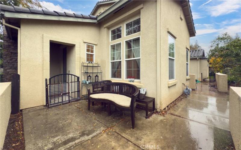 Front patio with side patio access.