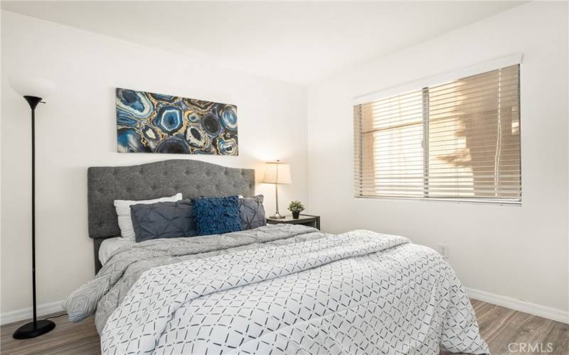 guest bedroom has been recently upgraded with luxury vinyl plank flooring