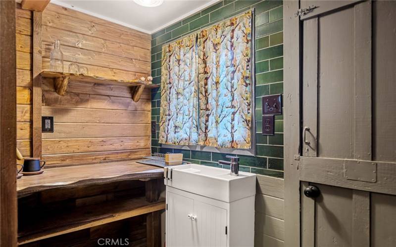 walking into guest house is a mini kitchen/sink/bathroom