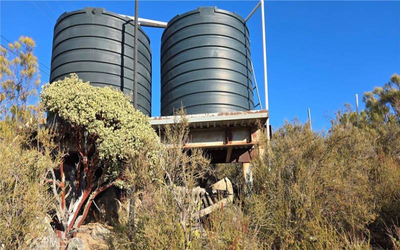 Two water tanks on raised metal platform