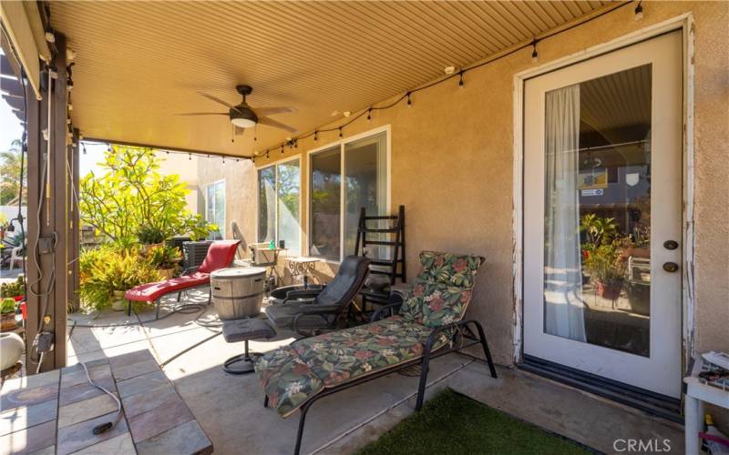 covered patio with lights and fan.