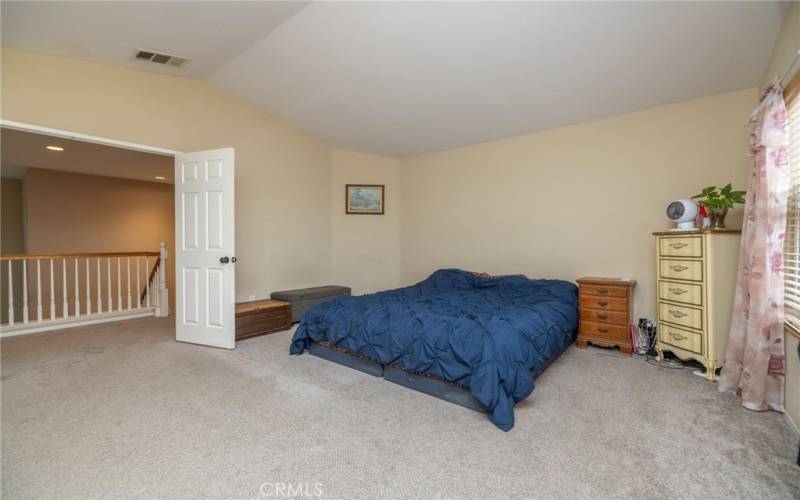 Large Master bedroom, double-door entry.