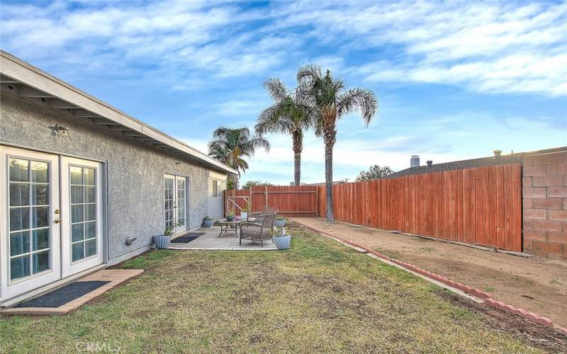 Back yard off of bonus room and primary bedroom