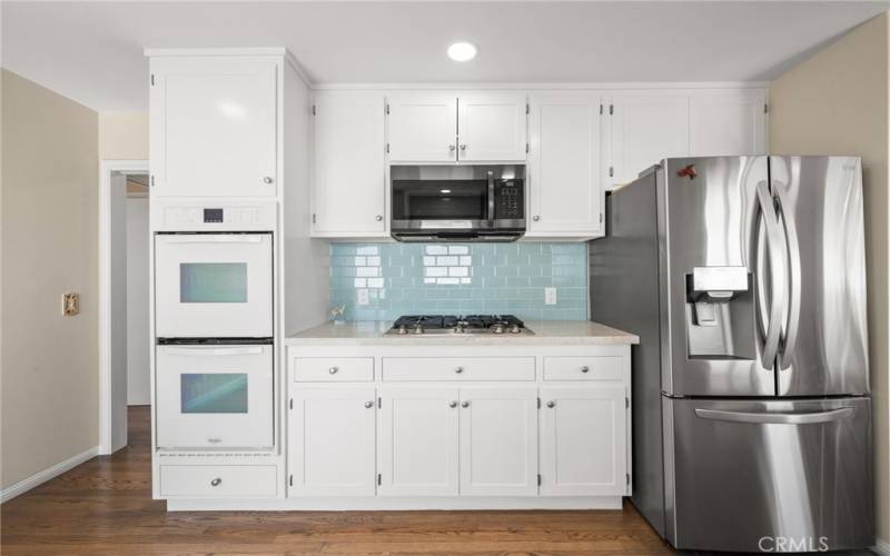 Kitchen with white cabinets and ocean views