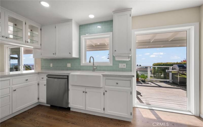 Kitchen with white cabinets and ocean views