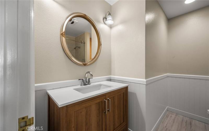 Hall bathroom with vanity & sink and tub/shower