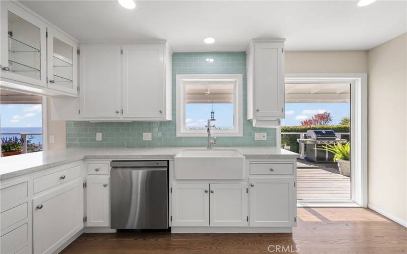 Kitchen with white cabinets and ocean views