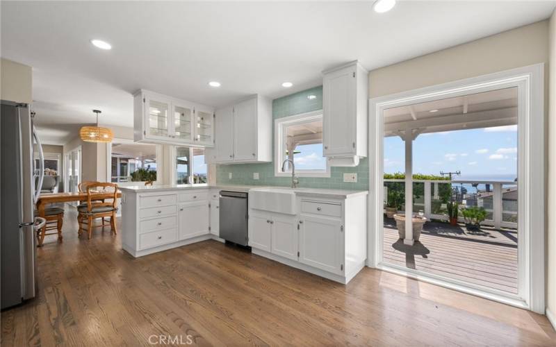 Kitchen with white cabinets and ocean views