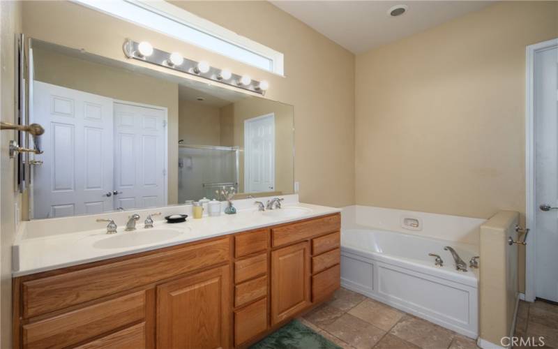 Primary Bathroom with separate sinks, soaking tub and we also have a walk-in shower.