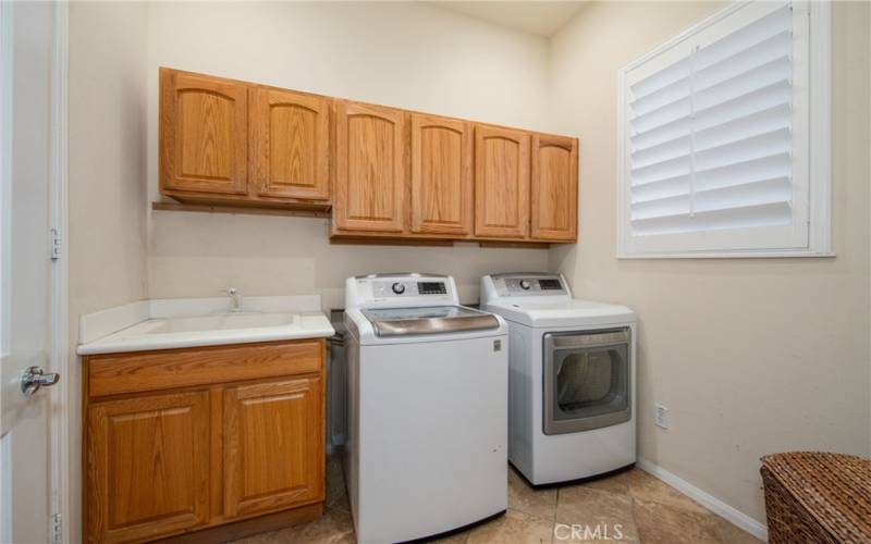 Interior Laundry Room with Sink Basin.