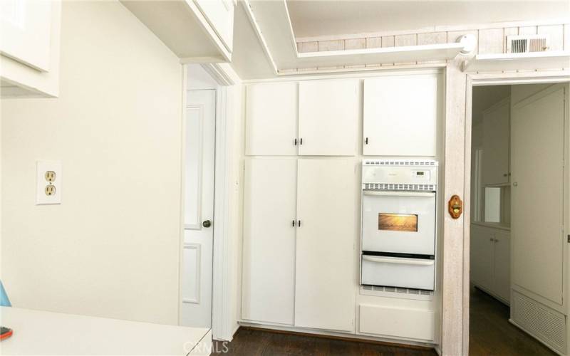 Entrance to kitchen. Wall oven and pantry