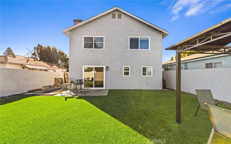 Green Turf in front of& back yard.