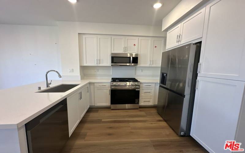 Kitchen with upgraded quartz and appliances included