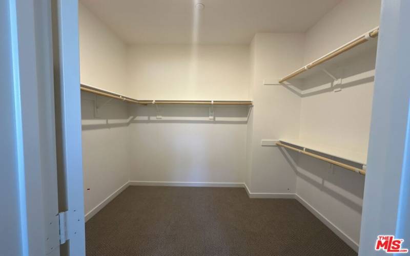 Spacious walk-in closet in primary suite