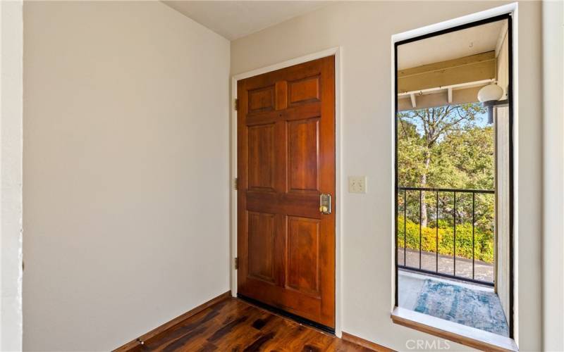 Greet your guests at the door. The long window allows natural light inside.