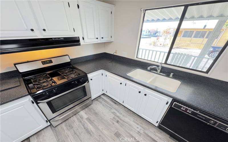 White cabinetry and corian countertops