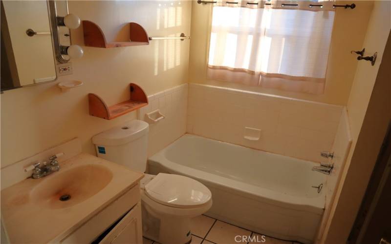 Bathroom with tub and shower, and makeup counter