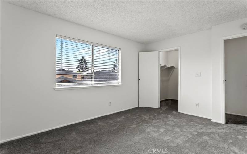 Primary bedroom with walk-in closet.