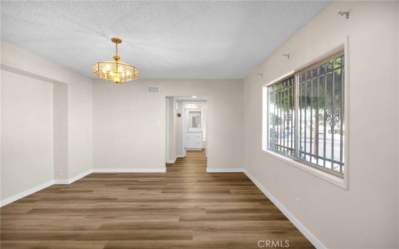 The dining room is connected to the main entrance by a foyer. It is also connected to the kitchen.