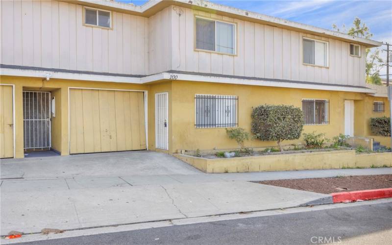 side entrance to the kitchen and garage connected to unit