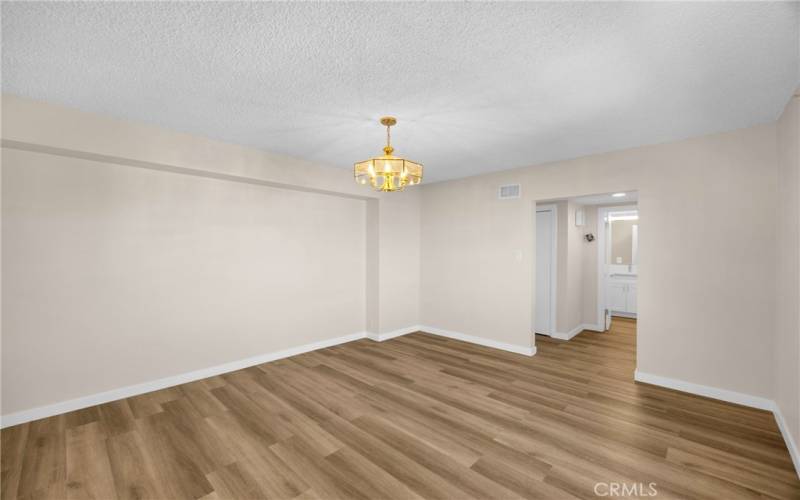 The second bathroom is located across the foyer from the dining room. It has a shower and tub, and a toilet.