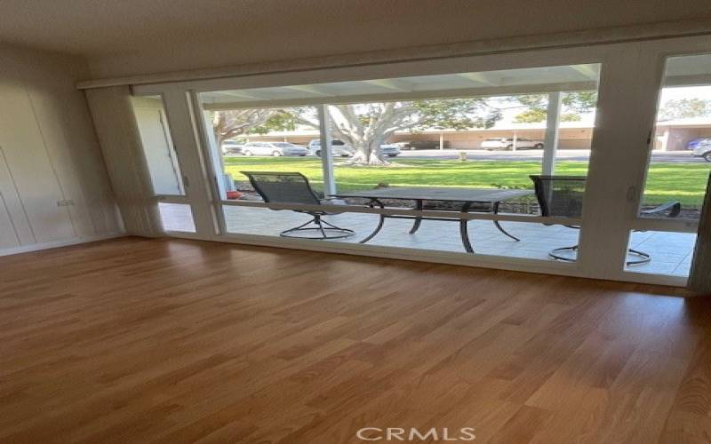 Living Room looks onto green space.