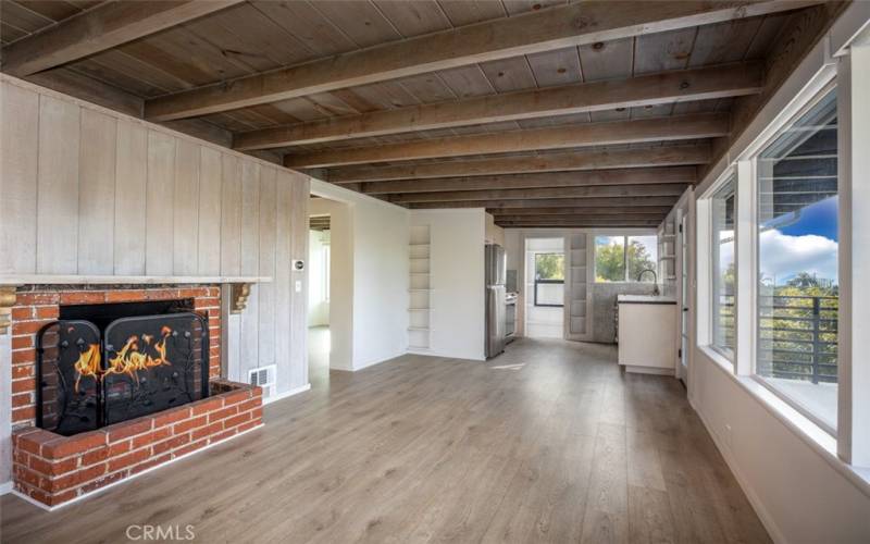 Wood burning fireplace in open floor plan