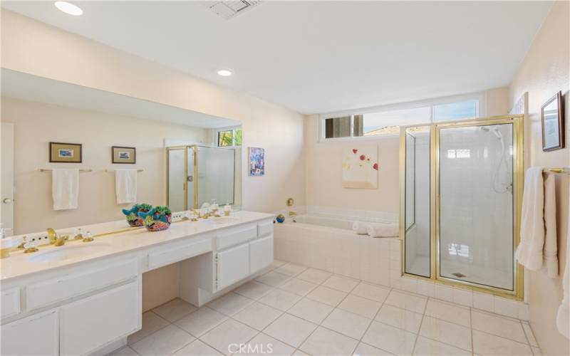 Primary bathroom with separate tub and shower