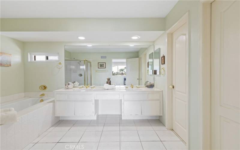 Primary bath with separate tub and shower- includes walk-in closet