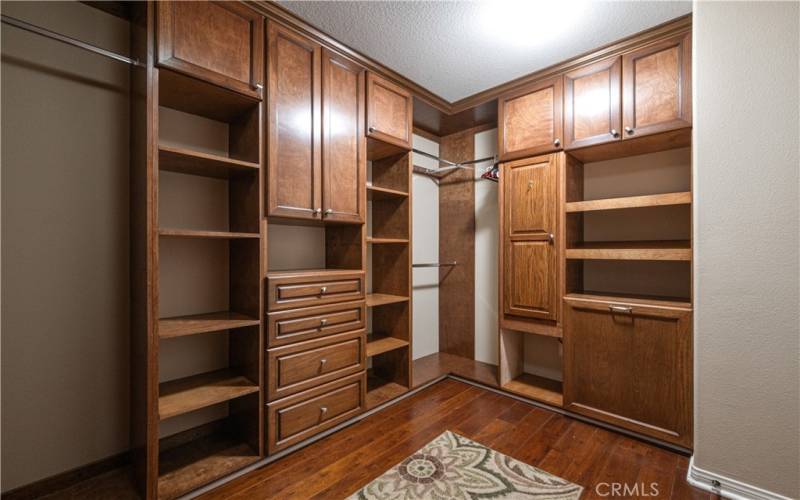 Primary bedroom walk-in closet