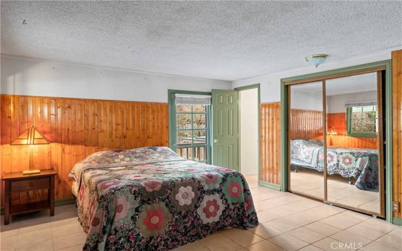 Main level bedroom with two closets.