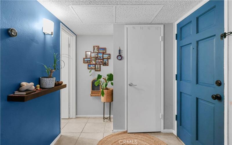 Front door entry with a coat closet.