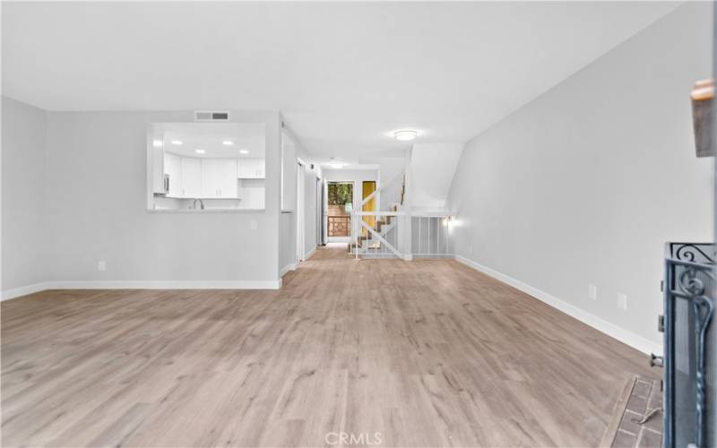 View from Living Room Fireplace towards Entry and Front Door