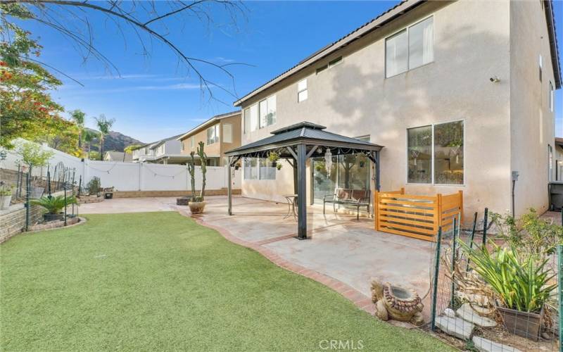 Backyard with portable gazebo & wood burn firepit