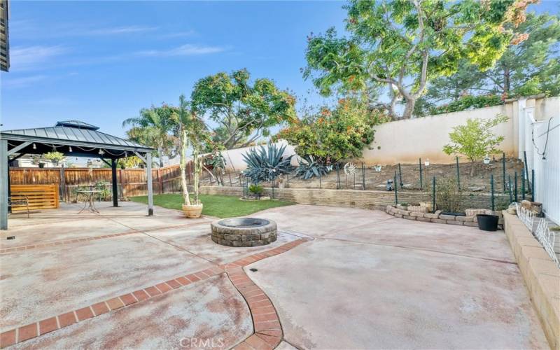 Backyard with portable gazebo & wood burn firepit