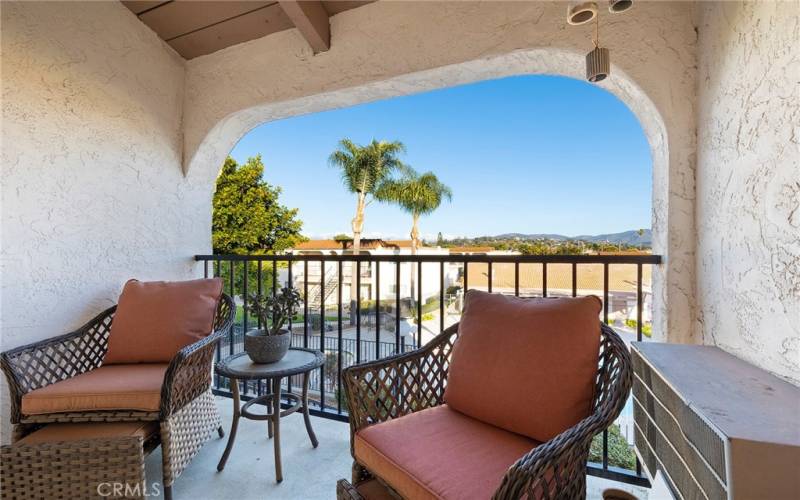 Front patio area with view of surrounding hills and city lights at night