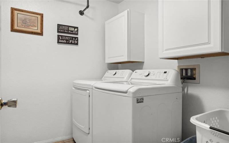 Laundry room with newer washer/dryer included.