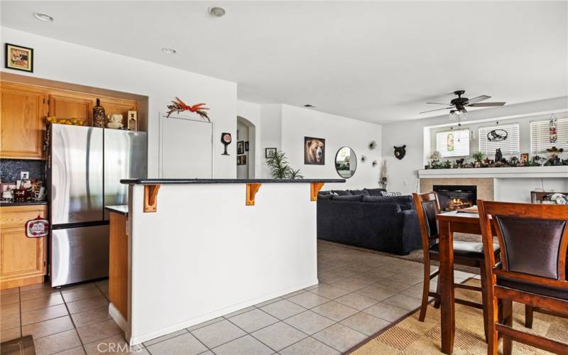 Kitchen with stainless steel fridge.