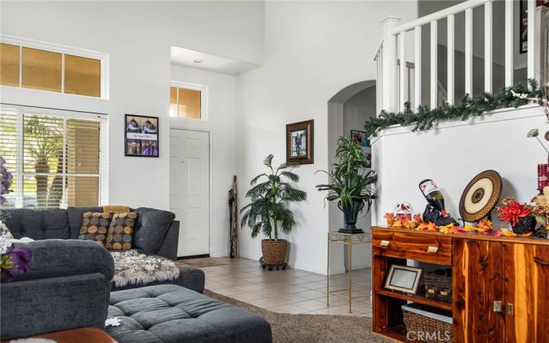 Entry and living room with vaulted ceilings.