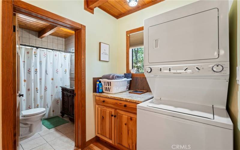 Laundry area and entry to full bathroom.