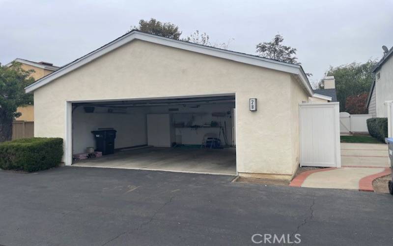 Open garage with open gate