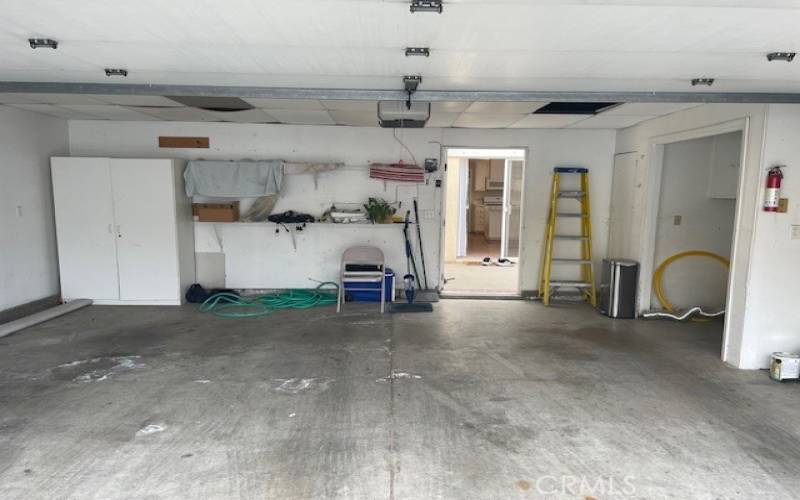 Garage with visible laundry hook up area