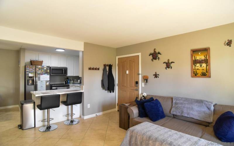 Living room and kitchen bar.