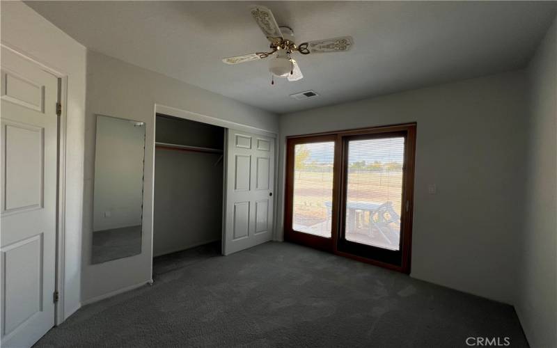 Doors to the back yard from the bedroom