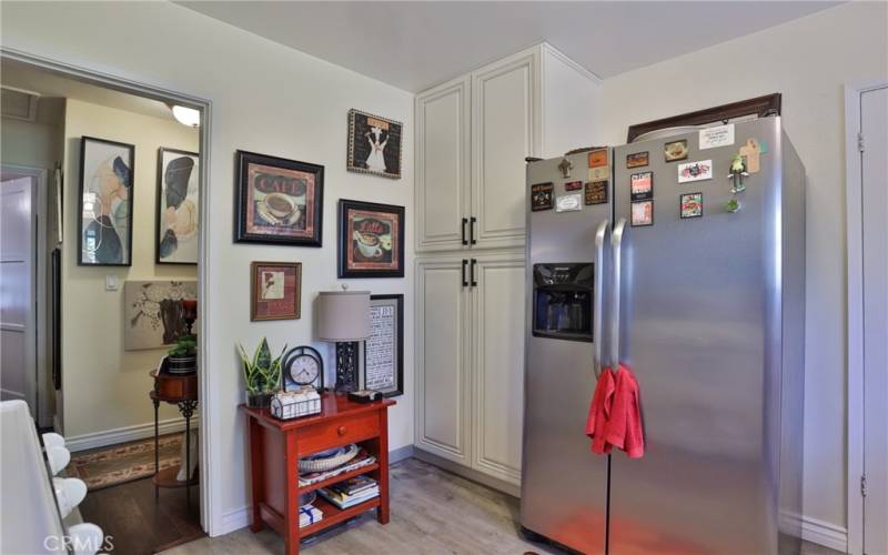 Plenty of cabinets for food storage next to the refrigerator. Did I mention that the fridge stays with the home?